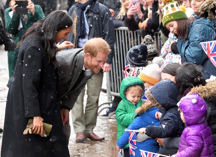 Meghan and Harry stop to talk to pre-school children during their public walkabout at Bristol Old Vic. *(Source: Getty)*