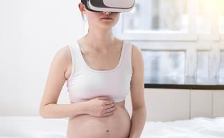 Pregnant woman using virtual reality headset