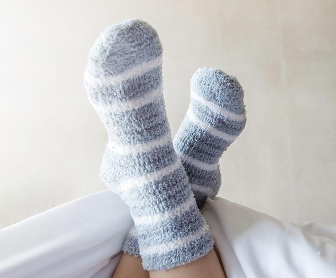 A pair of warm socks could be your night ticket for the dream express. *(Image: Getty)*