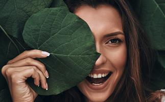 woman beauty shot behind leaf