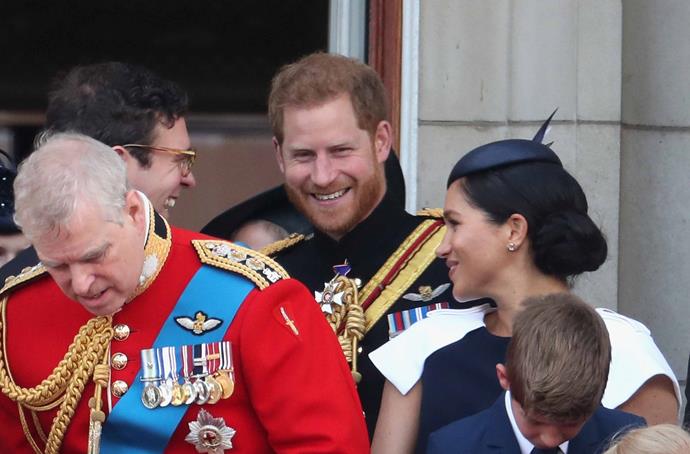 Prince Harry and Meghan share a laugh with Princess Eugenie's husband, Jack Brooksbank. *(Image: Getty)*