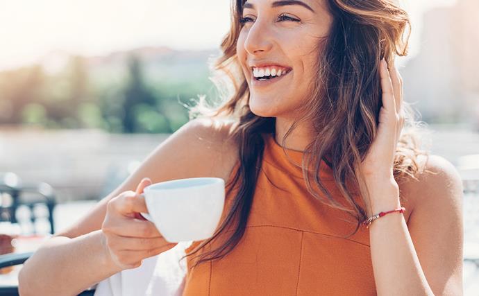 woman drinking coffee happy