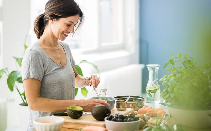 woman preparing healthy food in her kitchen