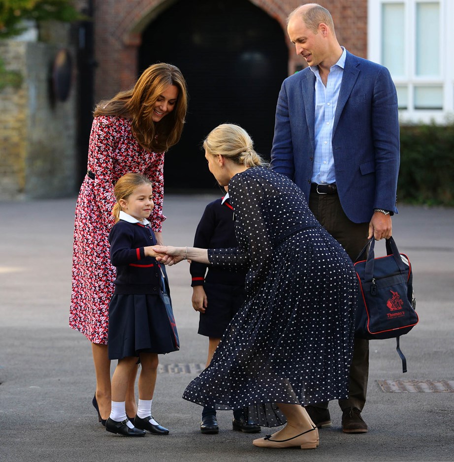 The Duke and Duchess of Cambridge and Princess Charlotte and Prince George at Thomas's Battersea on Charlotte's first day of school last year. *(Image: Getty)*