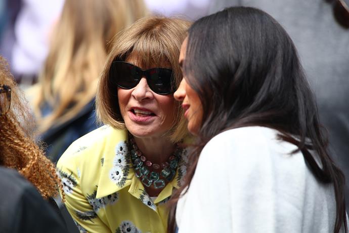 Meghan chats with Vogue's editor-in-chief Anna Wintour court-side at the US Open finals. *(Image: Getty)*