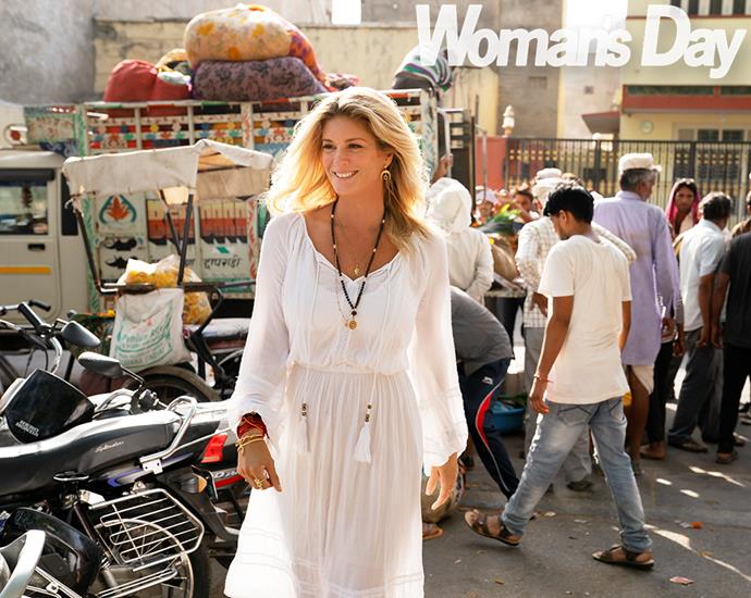 Rachel stands out in one of the bustling markets in Jaipur, where she adds to her beautiful collection of bracelets.