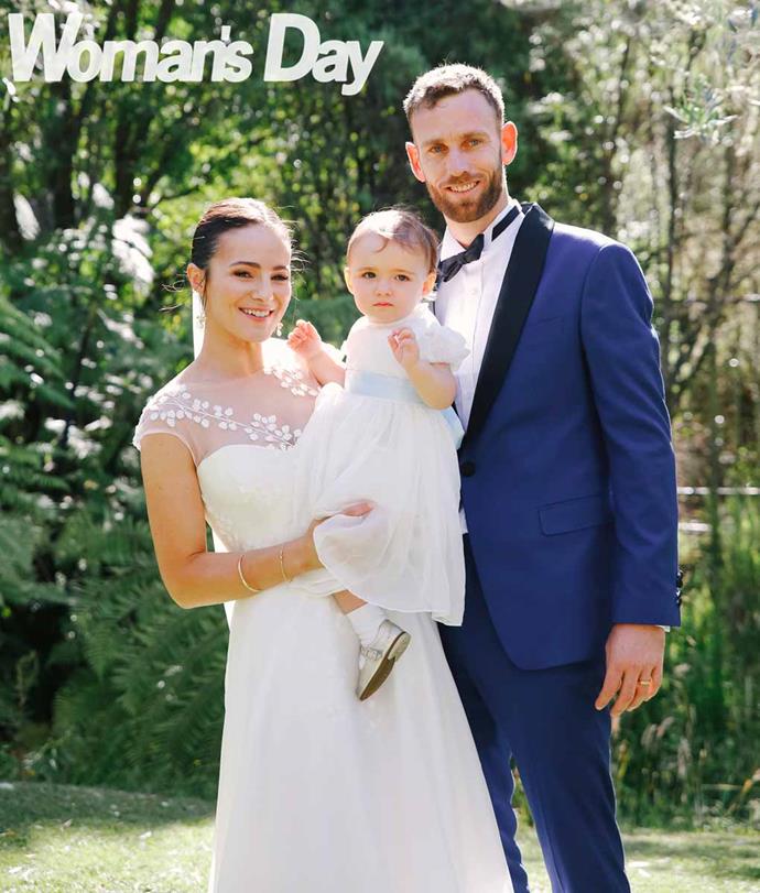 The happy couple with daughter Lila, who wears a beautiful dress made by Sally's mum.