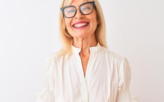 mature woman smiling wearing glasses