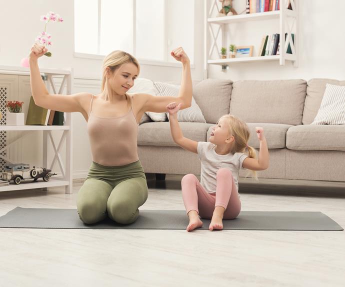 Mother and daughter doing yoga together