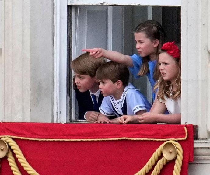 The children looked on while Charlotte pointed out to the crowd. *(Image: Getty)*