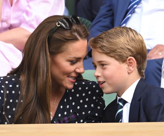 George shares a secret with mum Catherine at Wimbledon. *(Image: Getty)*