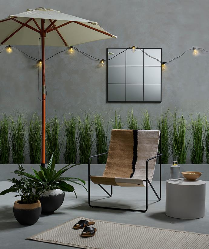 Mirrors can bring light and a sense of space to outdoor areas. Wall, floor and planter box painted in [Resene Half Tapa](https://shop.resene.co.nz/testpots/l/resene-colour-id:1394?colour=Half%20Tapa|target=