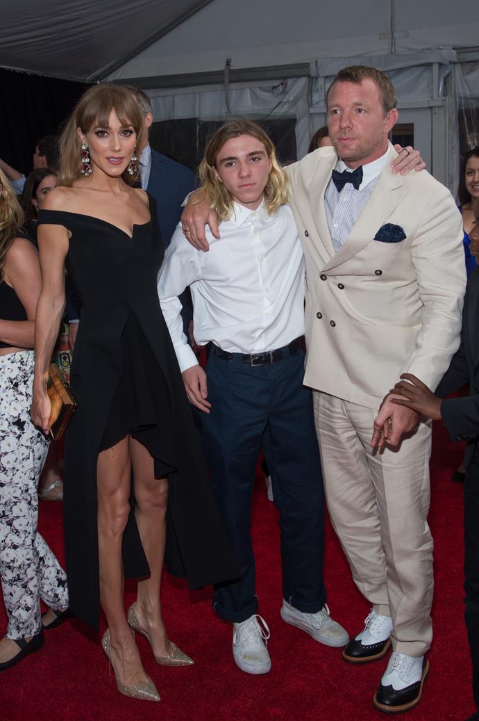 Rocco with his step-mum Jacqui (left) and dad Guy Ritchie (right). Photo: Getty.