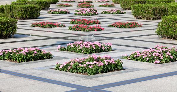  A different take on the knot garden, with hedges used to edge a geometric paved area inset with flowers.