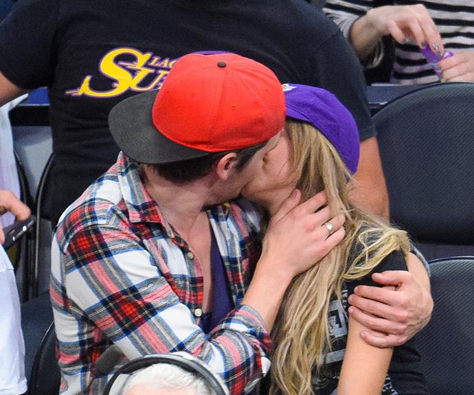 Modern Family star Sarah Hyland clearly isn’t shy about showing off her feelings for new boyfriend Dominic Sherwood as the pair gave a big on-camera smooch at a basketball game together in Los Angeles.