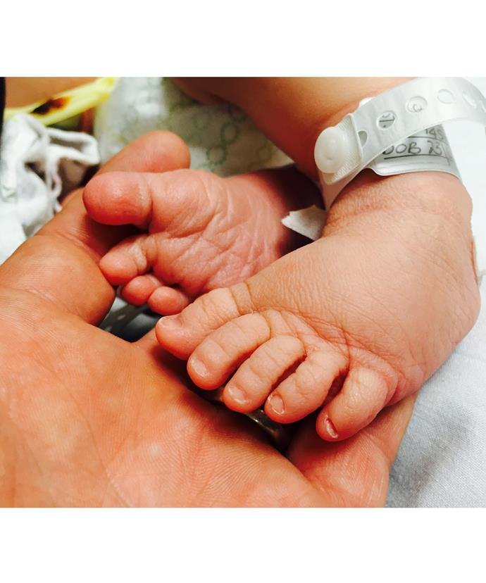 The couple have shared this touching first snapshot of their little girl's tiny feet.