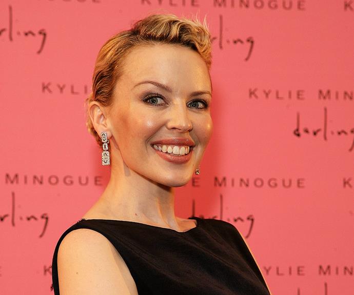 Kylie shows off her amazing cropped hairstyle following her recovery from breast cancer at a photocall in Sydney in November 2006.