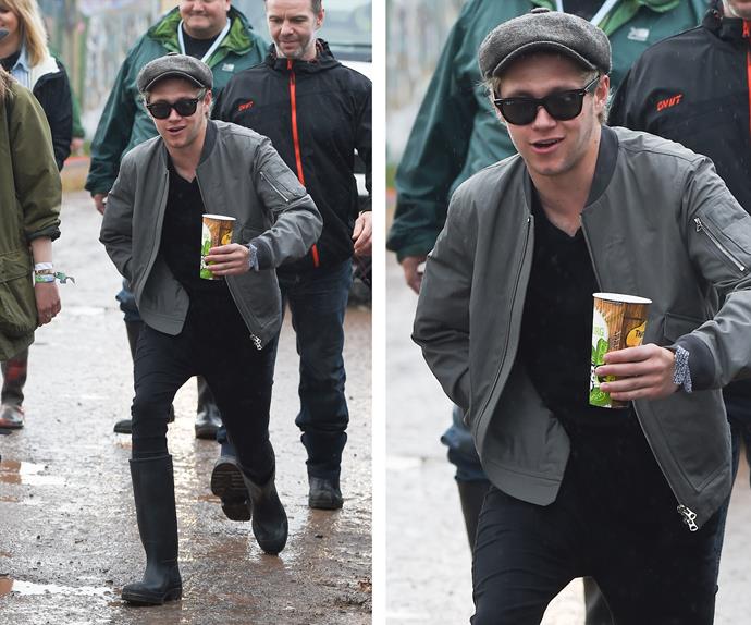 Resident class clown Niall Horan tried to escape the rain to spectacular fashion!