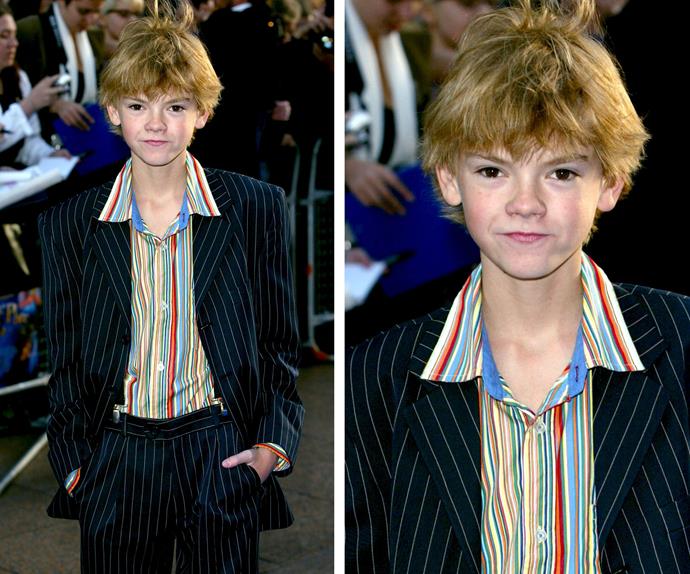 You also might remember Thomas from the film *Nanny McPhee*; here he is rocking a stylish pin-striped suit at the premiere.