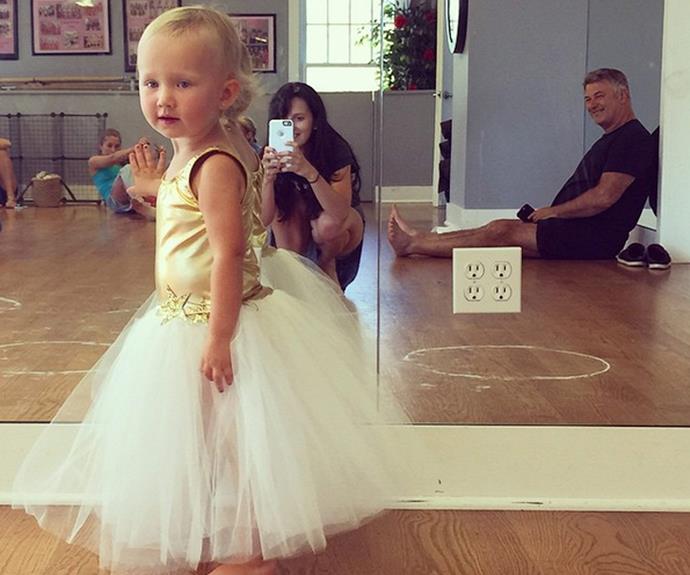 Hilaria and Alec Baldwin watch on as their adorable daughter, Carmen gets ready for dance class. We simply love that tutu!