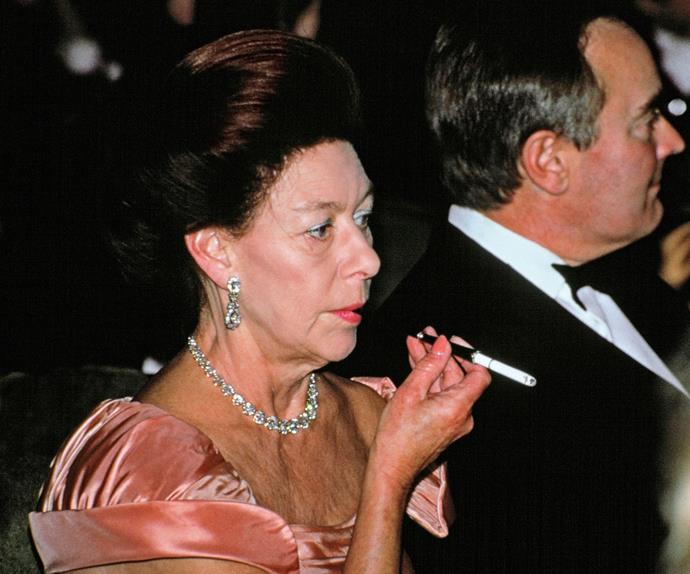 Decked out in her finest jewels Princess Margaret puffs back on a cigarette at the Gala For Aids Crisis Trust in 1991. Like her father, the royal was a heavy smoker and in 1985 she had part of her left lung removed.