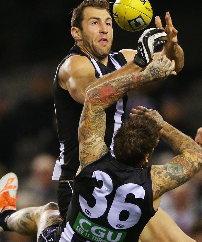 Travis and Dane in action for the Collingwood Football Club.