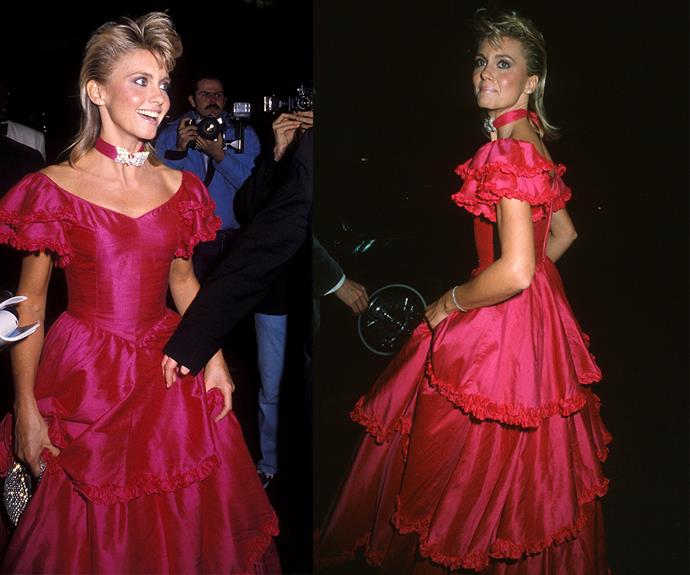 You're the one that we want! Olivia Newton-John looked like a real-life Barbie doll in this jaw-dropping fuchsia frilly gown at the 1983 bash.