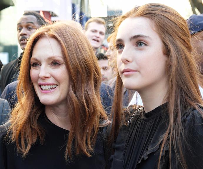 And it's clear that the Oscar winner's daughter is morphing into her pretty mother. Not only do they share the same alabaster skin, pink lips and pretty red hair, the mother-daughter duo both dressed in black tops  while opting for a natural look.
