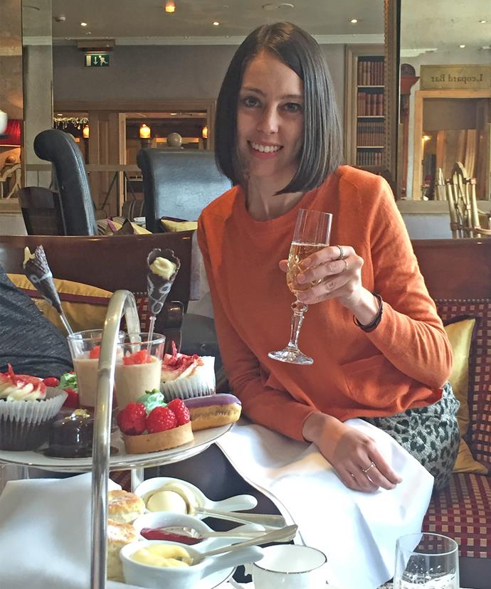 Cheers! *Woman's Day's* Foreign Editor Erin enjoys some bubbles with her traditional English afternoon tea.