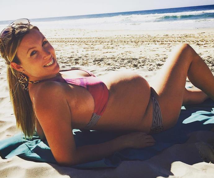 Last month, Tim's partner shared another bump snap as she soaked up the sun in Queensland.