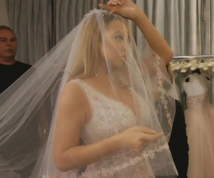In the new trailer, Mimi can be seen trying on wedding dresses! (Image/E!)