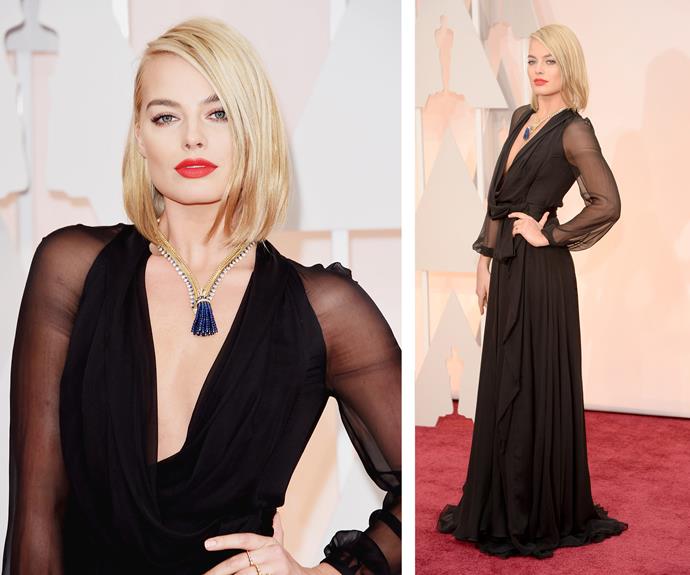 The star looked every bit as glamorous for the 2015 Academy Awards in deep plunge, black gown with a statement red lip.