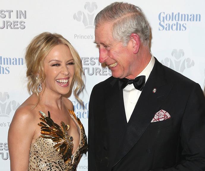 Don't worry, we'd be spinning around too! Miss Kylie Minogue accidentally sends Prince Charles into a giggling tizzy.